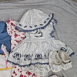 Lot of 26 pieces of assorted infant girls clothes. Sizes 6-12 months.